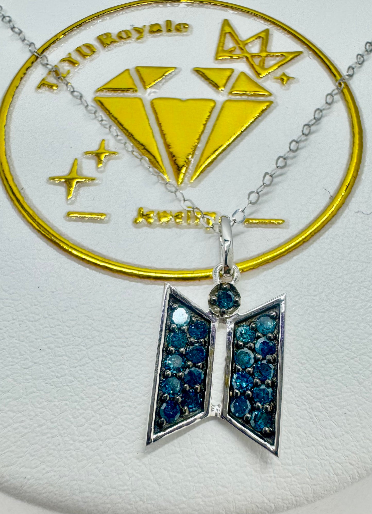 The Door to Dreams: 18K White Gold and Blue Diamond Fan Pendant